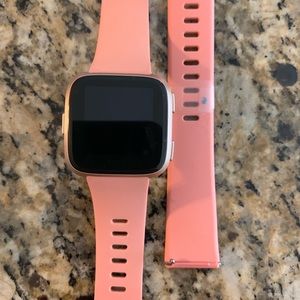 Fitbit with a coral band